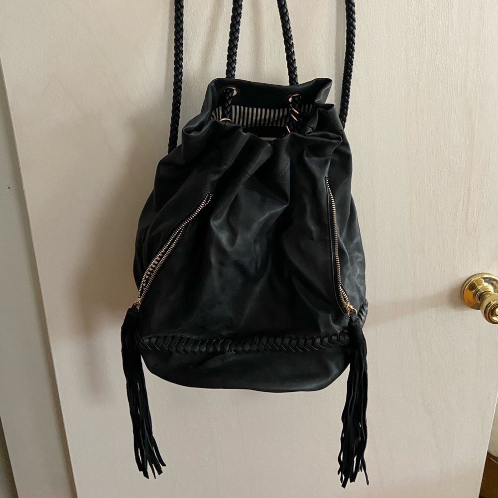 Fringe bucket backpack style purse